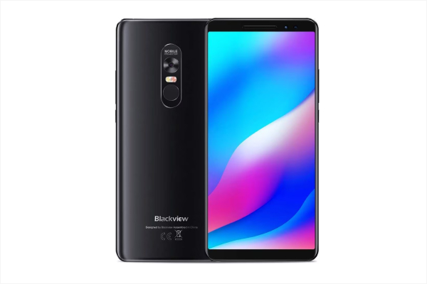 projector phone: Blackview Max 1 smartphone projecting 720p laser image onto a wall in a dark room.