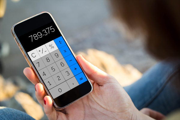 Smartphone screen showing a scientific calculator app and note-taking app, replacing physical tools.