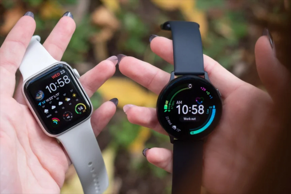 Smartphone displaying the time and fitness tracking stats, next to a wristwatch and fitness band.