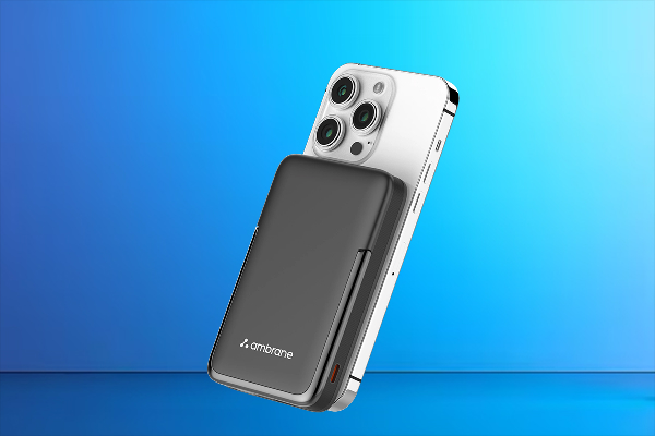 Ambrane MagSafe power bank attached to an iPhone for magnetic wireless charging.